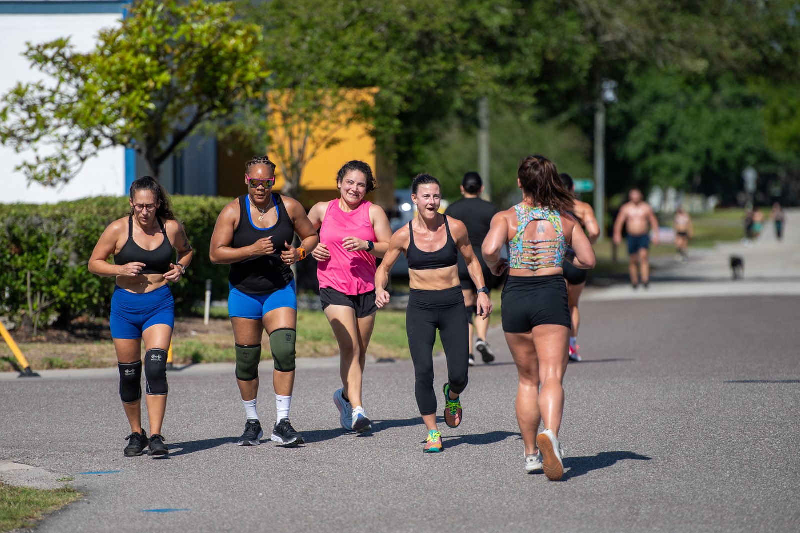 Group of CrossFit Sabal Park members running together outside the gym in Tampa