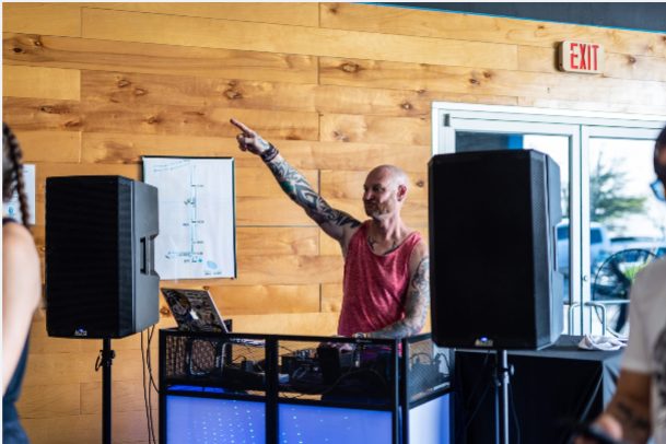 Coach announcing the intramural Open workout over the gym sound system